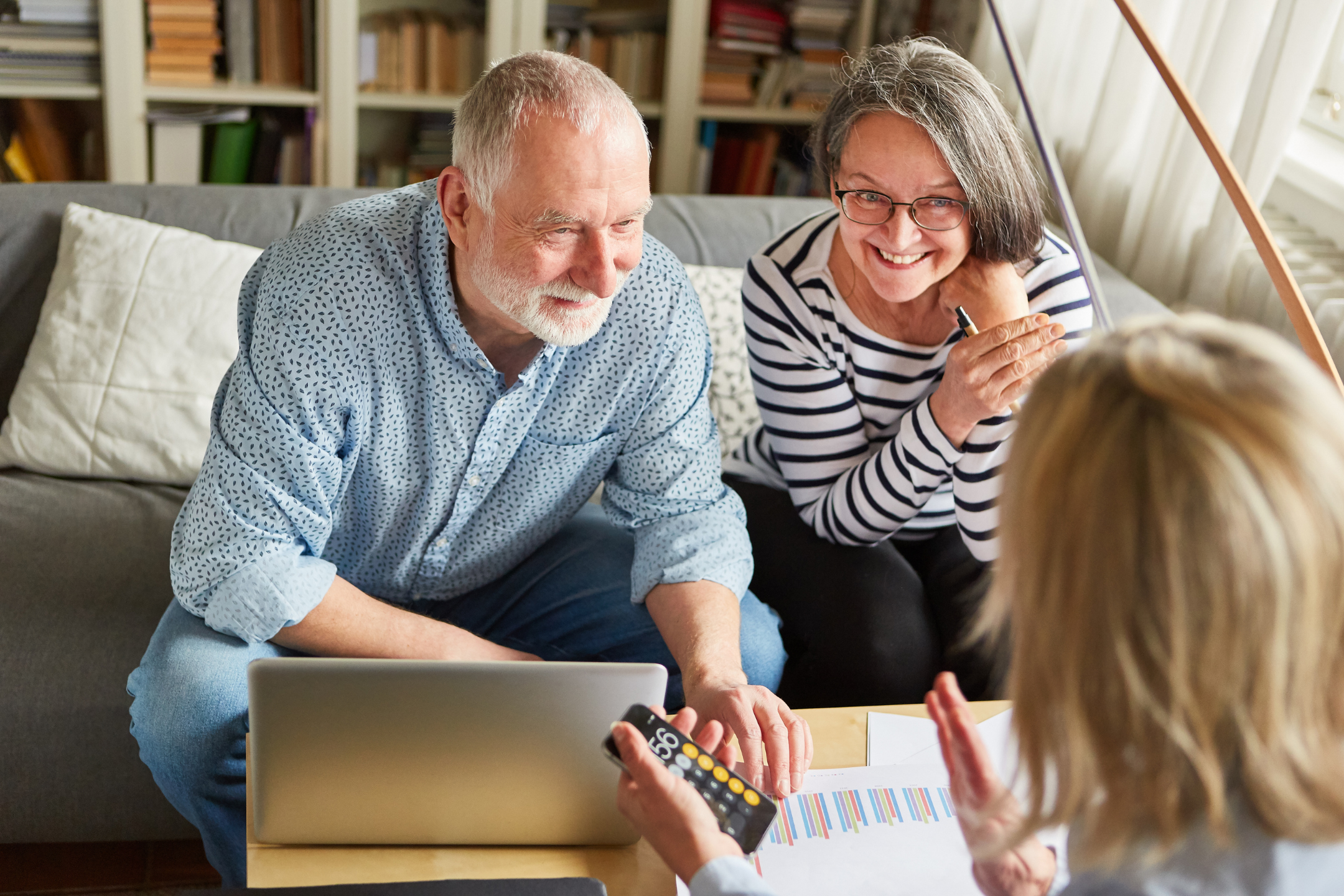 Two seniors consult a financial advisor.